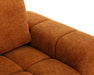 Gros plan sur le tissu polyester texturé orange du divan Olivia