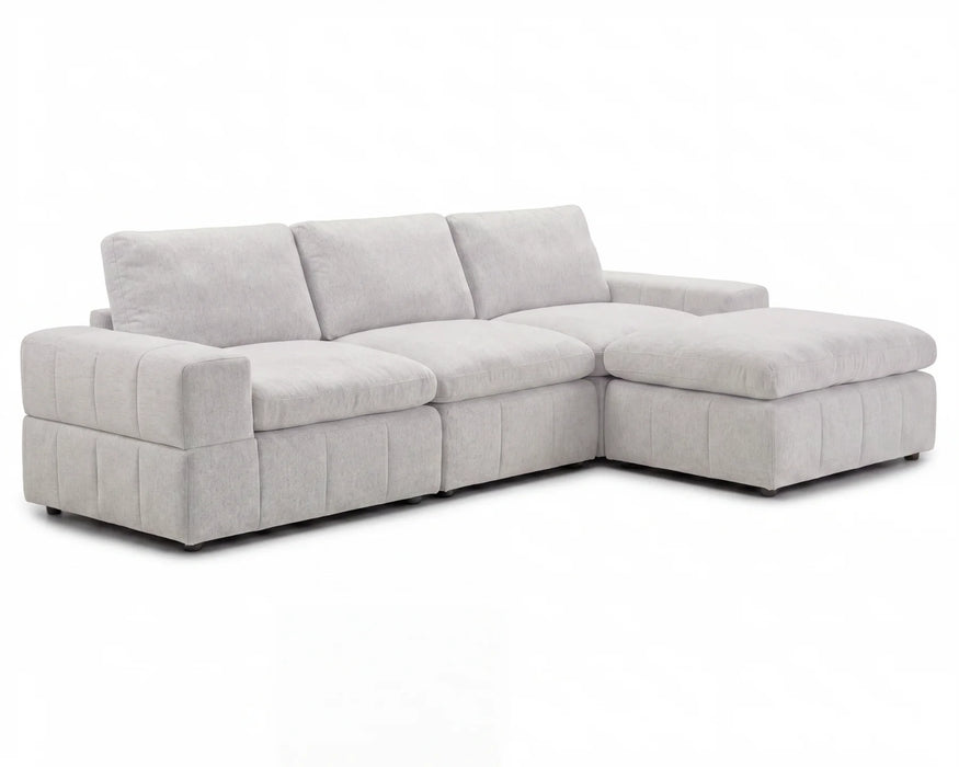 Sectionnel modulaire ENZO 3 places en tissu greige clair avec ottoman, vue en angle