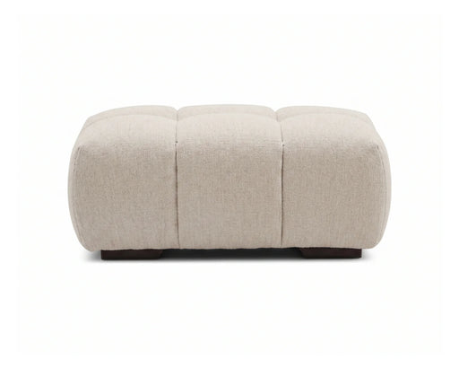 Ottoman capitonné OLIVIA beige crème avec pieds noirs, vue de face