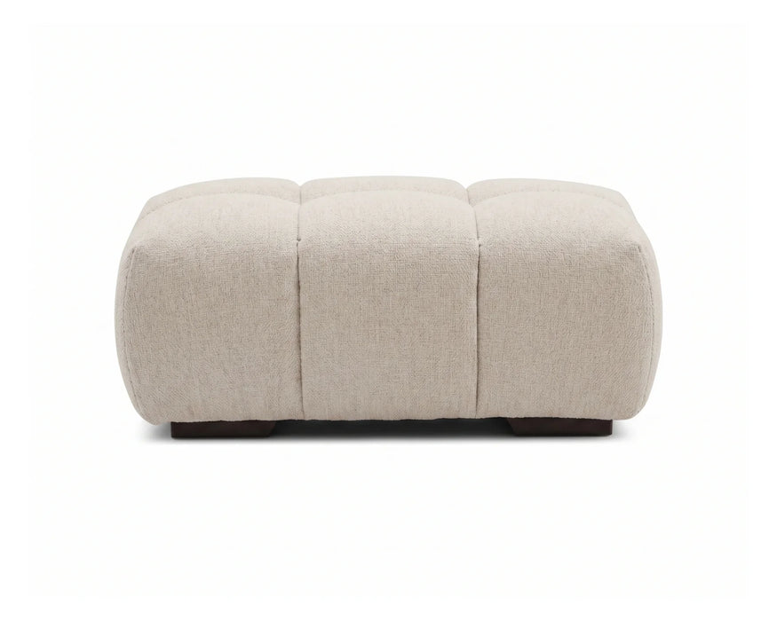 Ottoman capitonné OLIVIA beige crème avec pieds noirs, vue de face